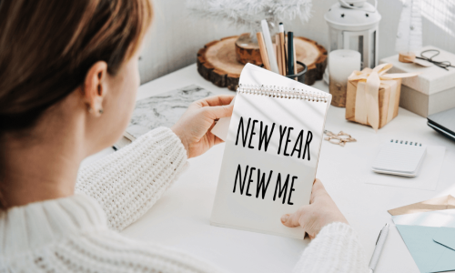 Women looking at new year resolution list for 2025